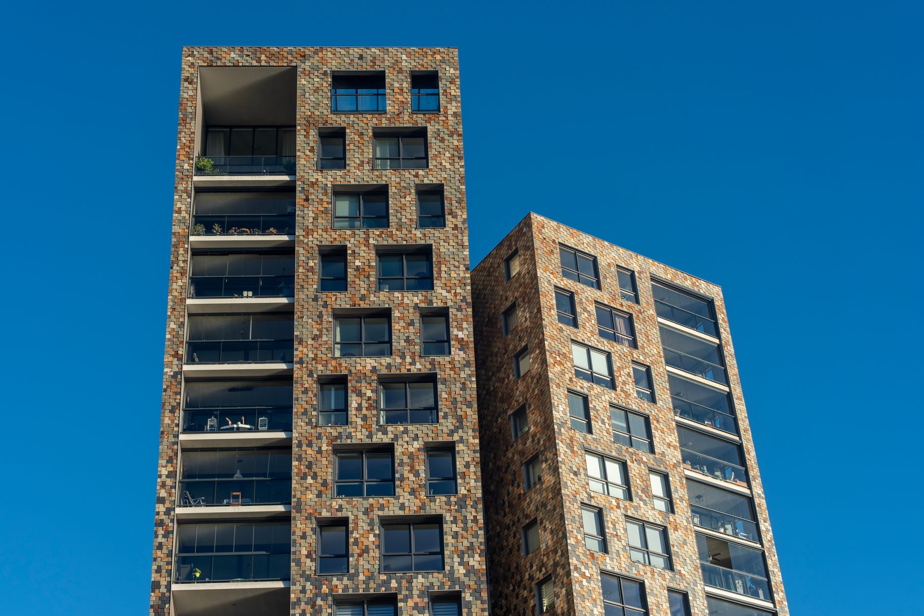 Modern high-rise residential buildings in Buenos Aires with a clean facade.